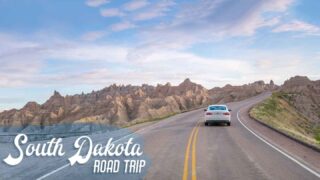 South Dakota road trip featured image car driving in the Badlands