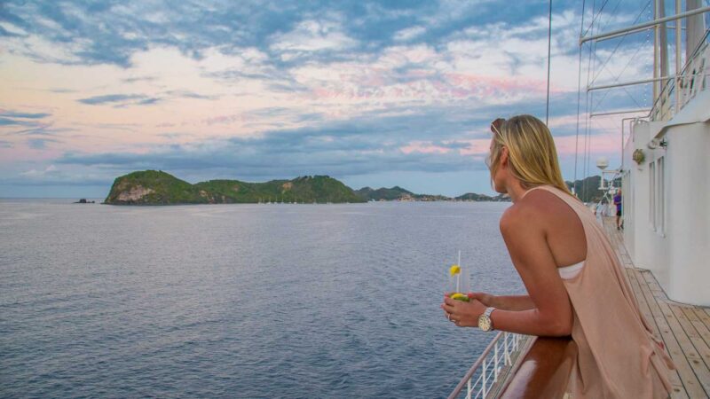 Girl watching sunset on a Windstar Cruise