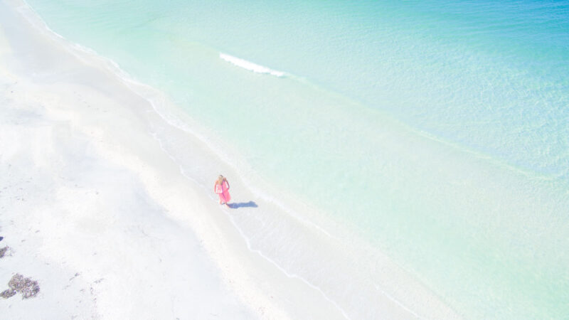 Woman walking on the shores of Cayo Costa State Park in Fort Myers top things to do