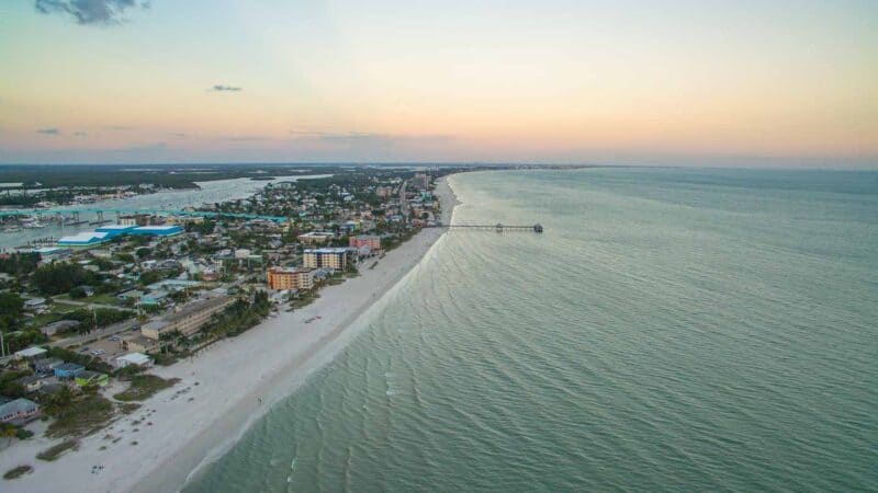 Orange and pink sunrise over fort myers beach florida is a must see 