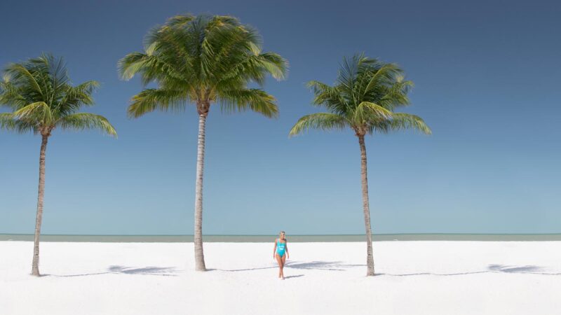 Woman walking the beach in Fort Myers Florida - Things to do in Fort Myers FL