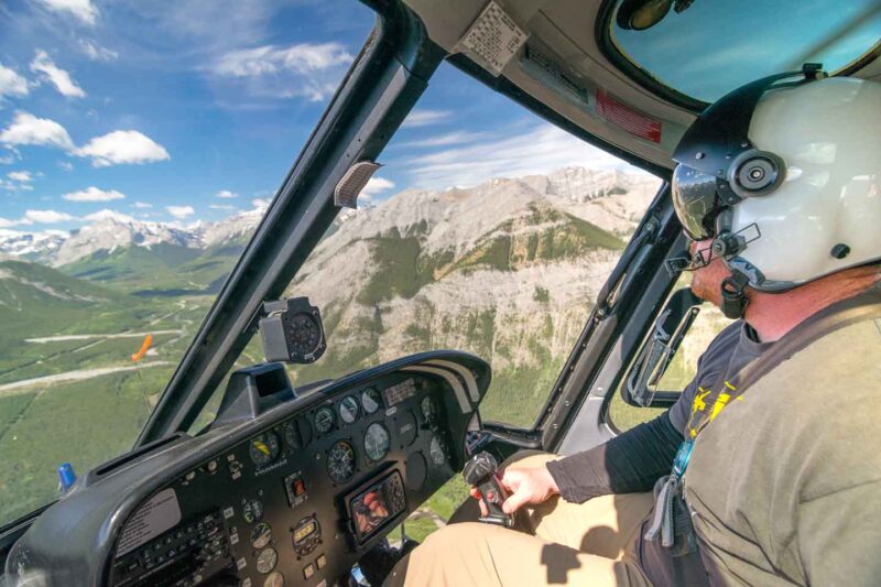 Banff Helicopter tour pilot flying a over the National Park