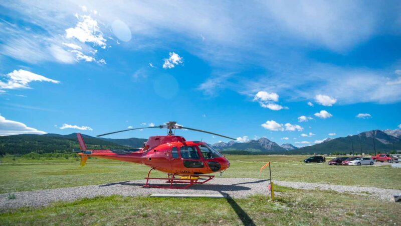 Red Helicopter in the Kananaskis heli pad near Banff National Park