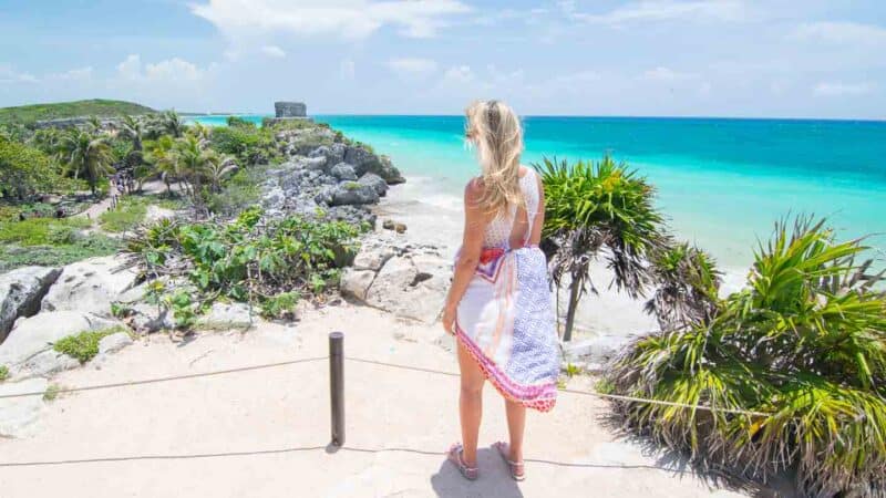 Woman standing at the tulum ruins near Grand Palladium Riviera Maya