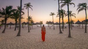 Woman walking Manchebo beach in Aruba on a honeymoon trip
