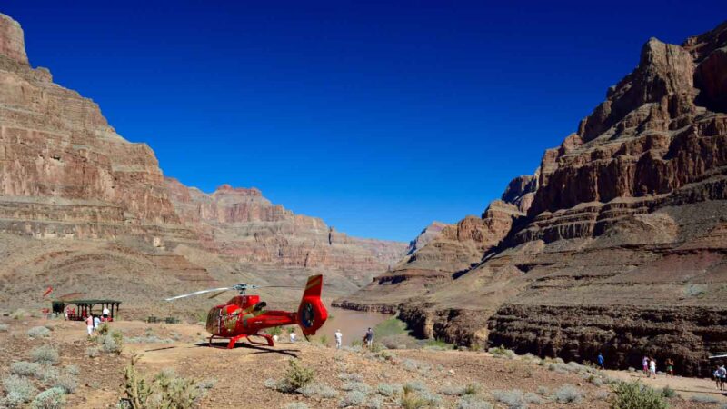 best Grand Canyon West Rim Helicopter tour landed in the canyon with people walking around