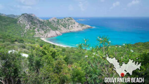 View from above Gouverneur Beach in St. Barts with bright blue waters and white sand