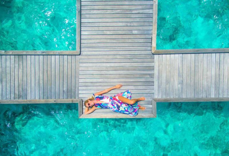girl on a dock in the Maldives 