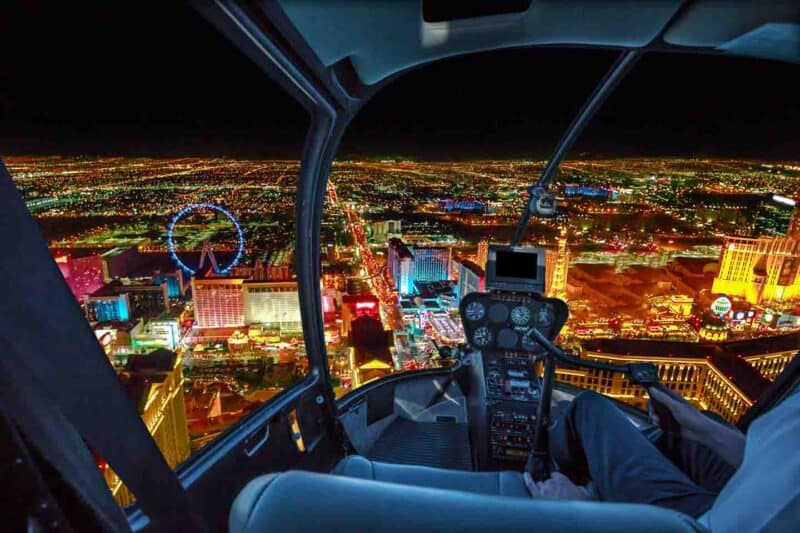 view from inside a helicopter flight over Las Vegas Strip at night