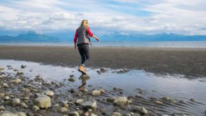 Woman tidepooling in homer Alaska - Top Activities