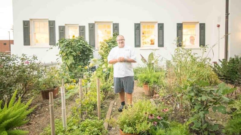 Chef and owner of the Spring house sanding in front of one of the best restaurants in Winston Salem 