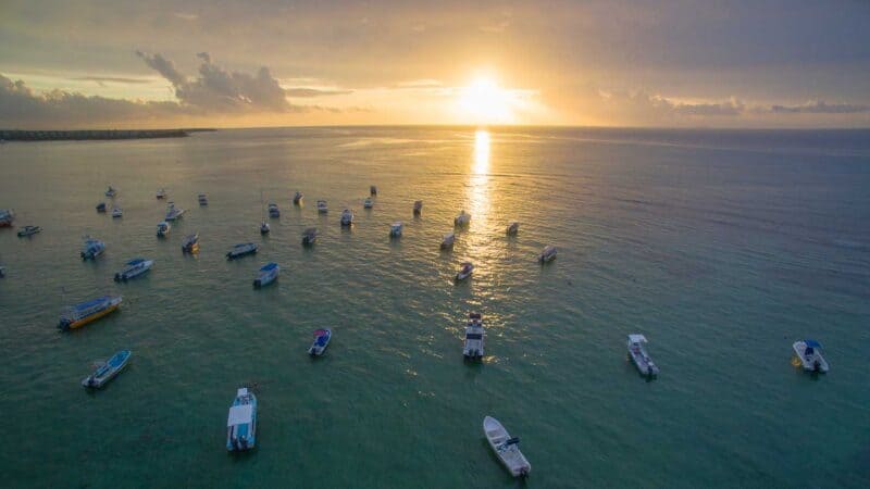 Boats off the shore of Playa del Carmen near Elements vacation rentals in Playa del Carmen