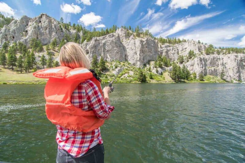 girl with a fishing rod in Holter Lake Montana