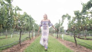 girl walking through vineyards in Yadkin Valley Winston Salem North Carolina