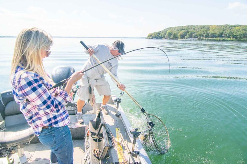 reeling in a fish in the net Greek Lake Wisconsin 