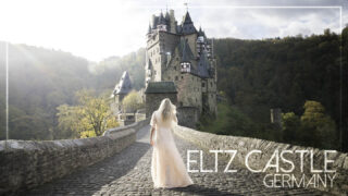 Featured Image for Burg Eltz Castle - Woman standing on the castle bridge in Germany