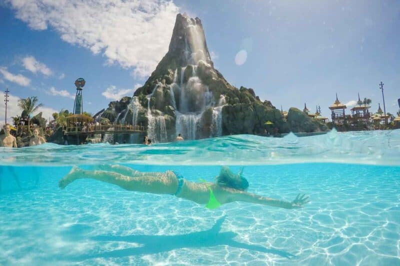 Woman swimming in an over under photo taken with a GoPro Dome at Universal Orlando