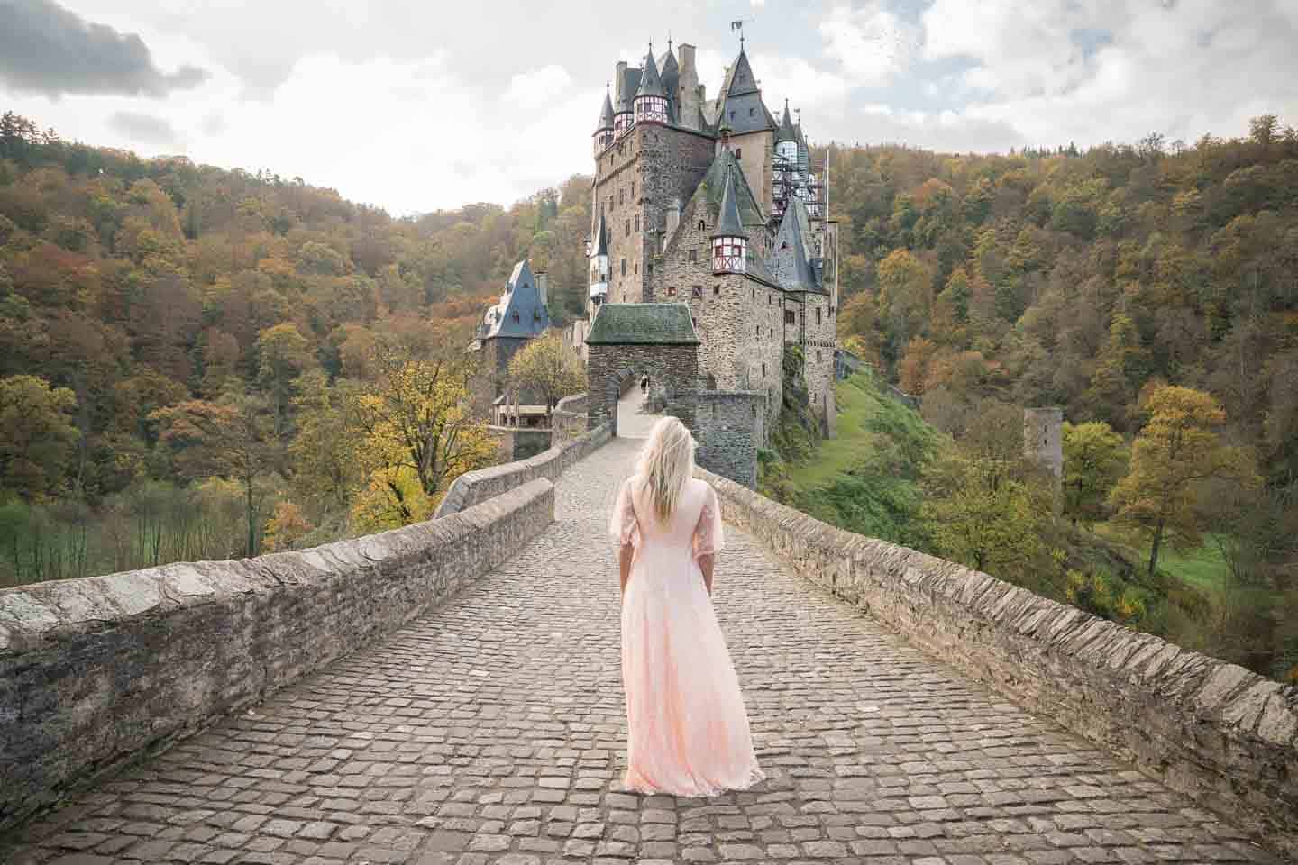 Morning at the Burg Eltz Castle bridge - Hannah in an old fashion dress