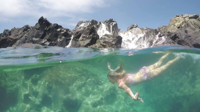 Woman swimming in the Aruba Natural Pool