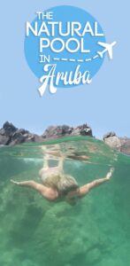 pinterest pin for Natural Pool Aruba - woman swimming in the pool
