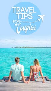 pinterest pin for couple travel tips - couple sitting on the dock
