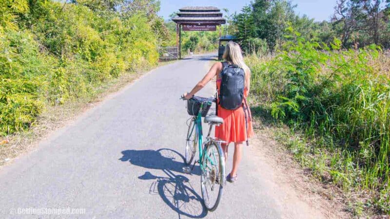 Girl walking bike in Inle Lake Myanmar