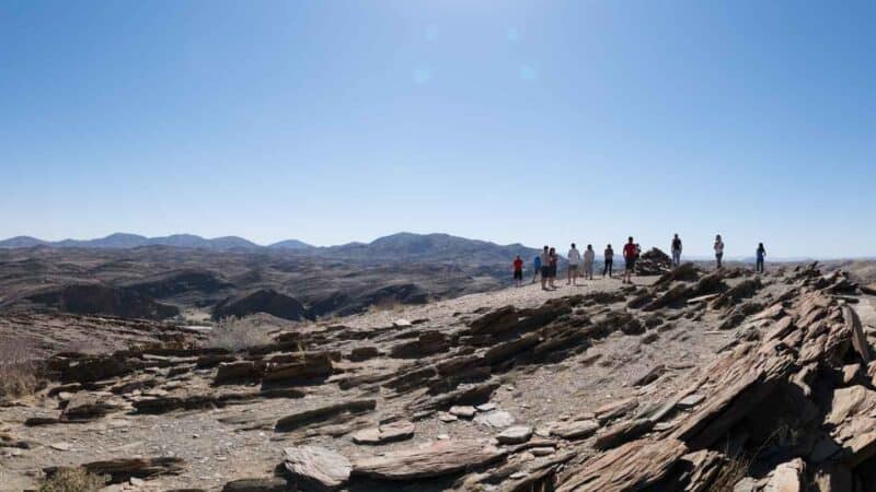 People standing on Namibia's Moon Landscapes - Things to do in Namibia