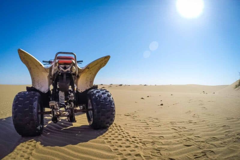 ATV parked on top of a sand dune in Namibia while on a ATV tour - Things to do in Namibia