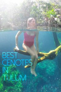 woman sitting on tree branch in a cenote near tulum - pinterest pin for best cenotes in Mexico