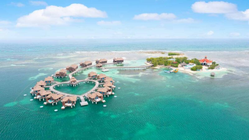 Drone photo of the private island at Sandals Royal Caribbean Resort in Montego bay Jamaica featuring the overwater bungalows