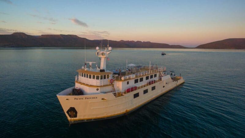 Offshore Outpost ship sailing in the Sea of Cirtex at sunset