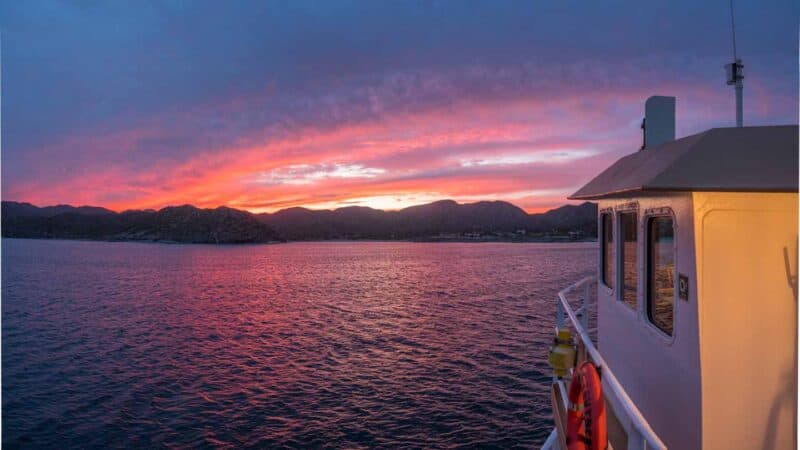 Pink and Orange sunset over the bridge of Offshore Outpost boat in the sea of Cortez - Baja Mexico