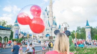 Woman in front of Disney castle in Kissimmee florida - top things to do