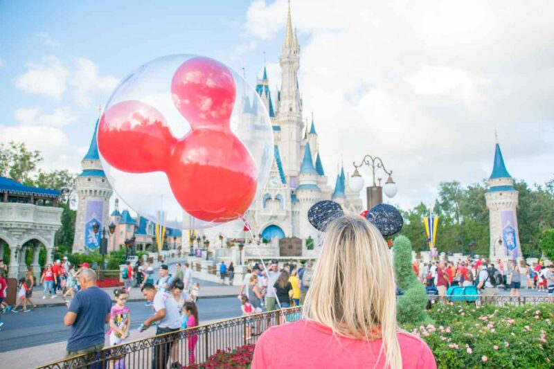 Woman in front of Disney castle in Kissimmee florida - top things to do