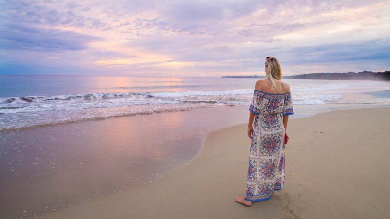 Woman standing on the beach in Puerto Viejo - Best Honeymoon beaches in Costa rica