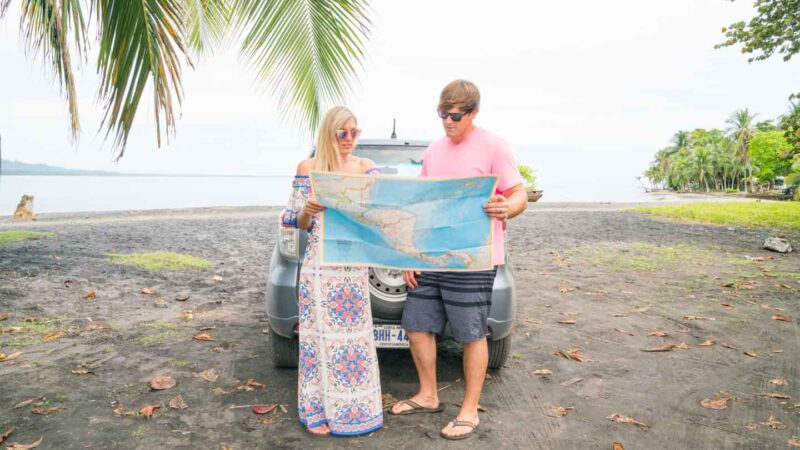 Couple looking at a map planning their Costa Rica Honeymoon Itinerary