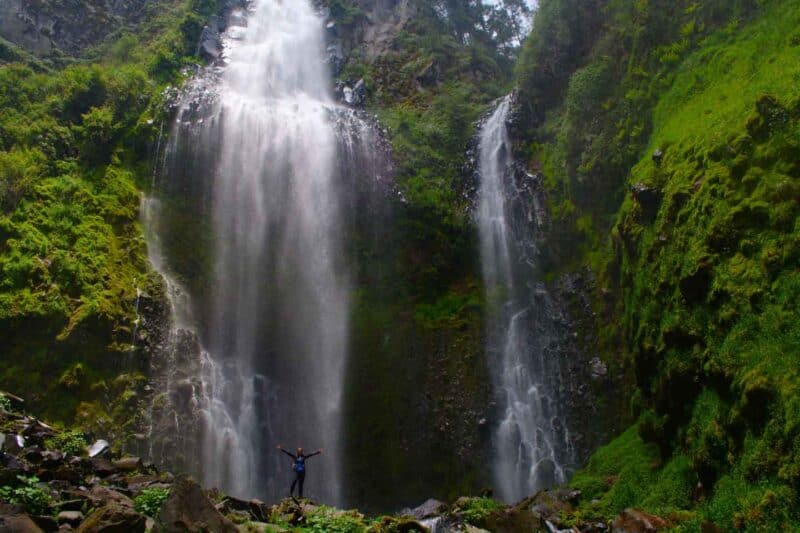 Person with arms up at Diamante Waterfall Costa Rica