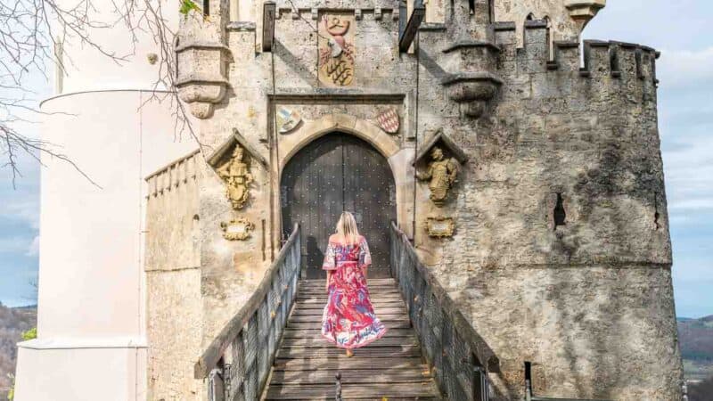 woman standing on the bridge to Lichtenstein Castle for a tour