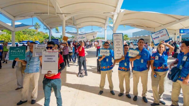 Hotel Shuttle Cancun Airport to Playa del Carmen people with signs