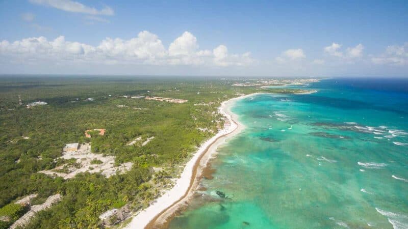 drone photo of Xpu Ha Beach and hotel grounds - white sand and clear waters