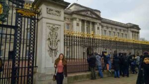 girl in front of Buckingham Palace on a 3 days in London trip
