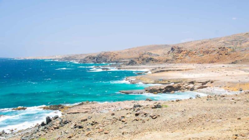 View of the aqua colored water at the shoreline at Arikok National Park in Aruba - Best things to do in Aruba