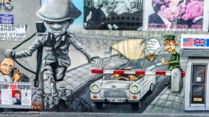 Spray paint mural at Check Point Charlie in Berlin - Can't miss sights in Berlin - 3 day itinerary
