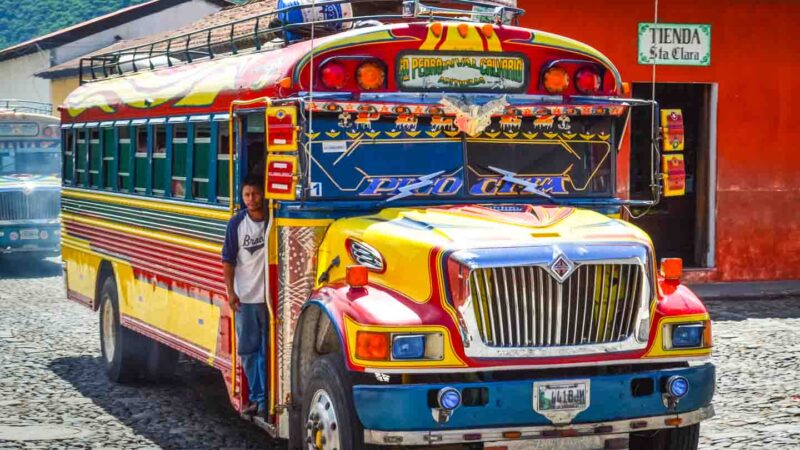 yellow red and blue chicken bus in Antigua Guatemala - things to do in Antigua