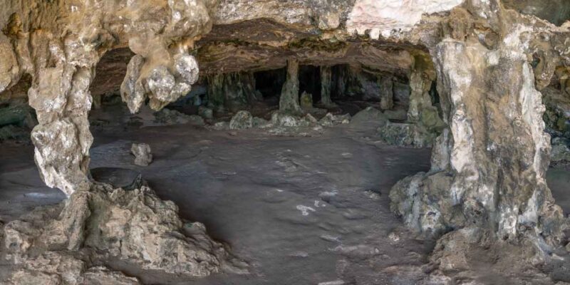 View of the inside of Fontein Cave in Aruba with stalactites - Best things to do in Aruba