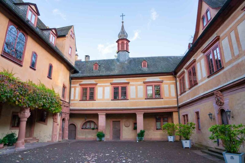 Orange pink and white colored Renaissance style courtyard of Mespelbrunn Castle
