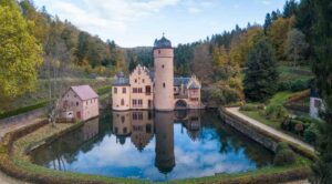 Photo from above Mespelbrunn Castle with a reflection on the water of the castle