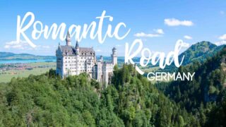 Neuschwanstein Castle on a sunny day - with text overlaid Featured image for Romantic Road Germany