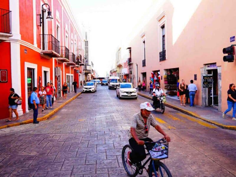 man riding his bike on the street in Merida 