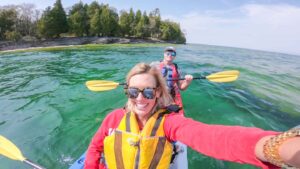 a couple Kayaking in Lake Michigan in Door County - 3 day weekend in Door County